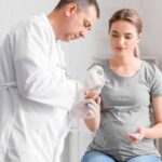 Diabetes specialist checking blood sugar and guiding treatment.