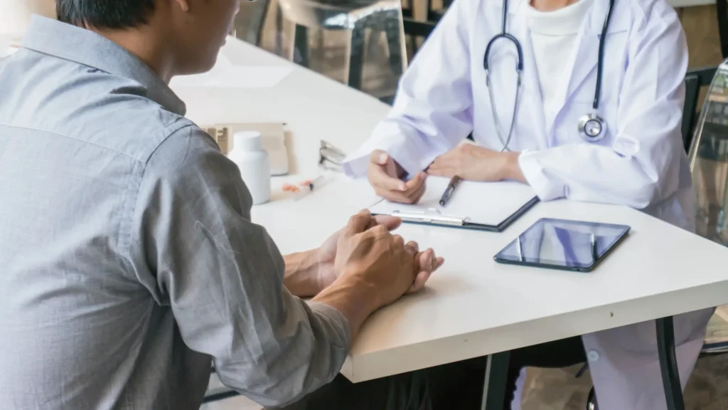 Person managing diabetes with healthy food and glucose check.